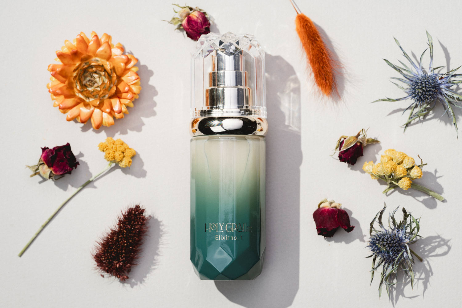 Elixir no. 1 bottle surrounded by flowers