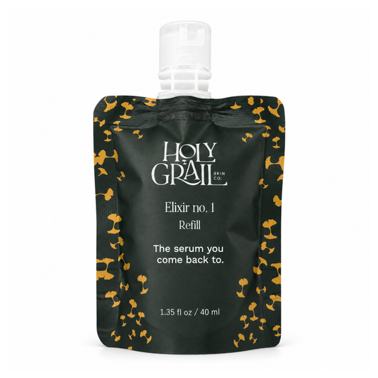 Holy Grail Elixir No. 1 Serum refill pouch in black with gold ginkgo leaves and white text, featuring a clear flip-top cap, on a white background.